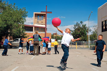 Kindergartner Elijah Martinez jumps to catch a red rubber ball during recess at St. Francis Elementary School in Gallup Thursday.© 2011 Gallup Independent / Cable Hoover 